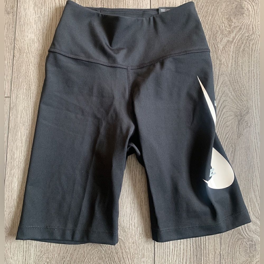 Nike woman’s tight fit mid rise running shorts